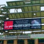 Vinyl Mesh Printing. Enormous size makes the difference between getting attention and getting lost in the noise. Spanning over three stories high, this building wrap for the aurora and ikon condo project is in Brooklyn, NY.